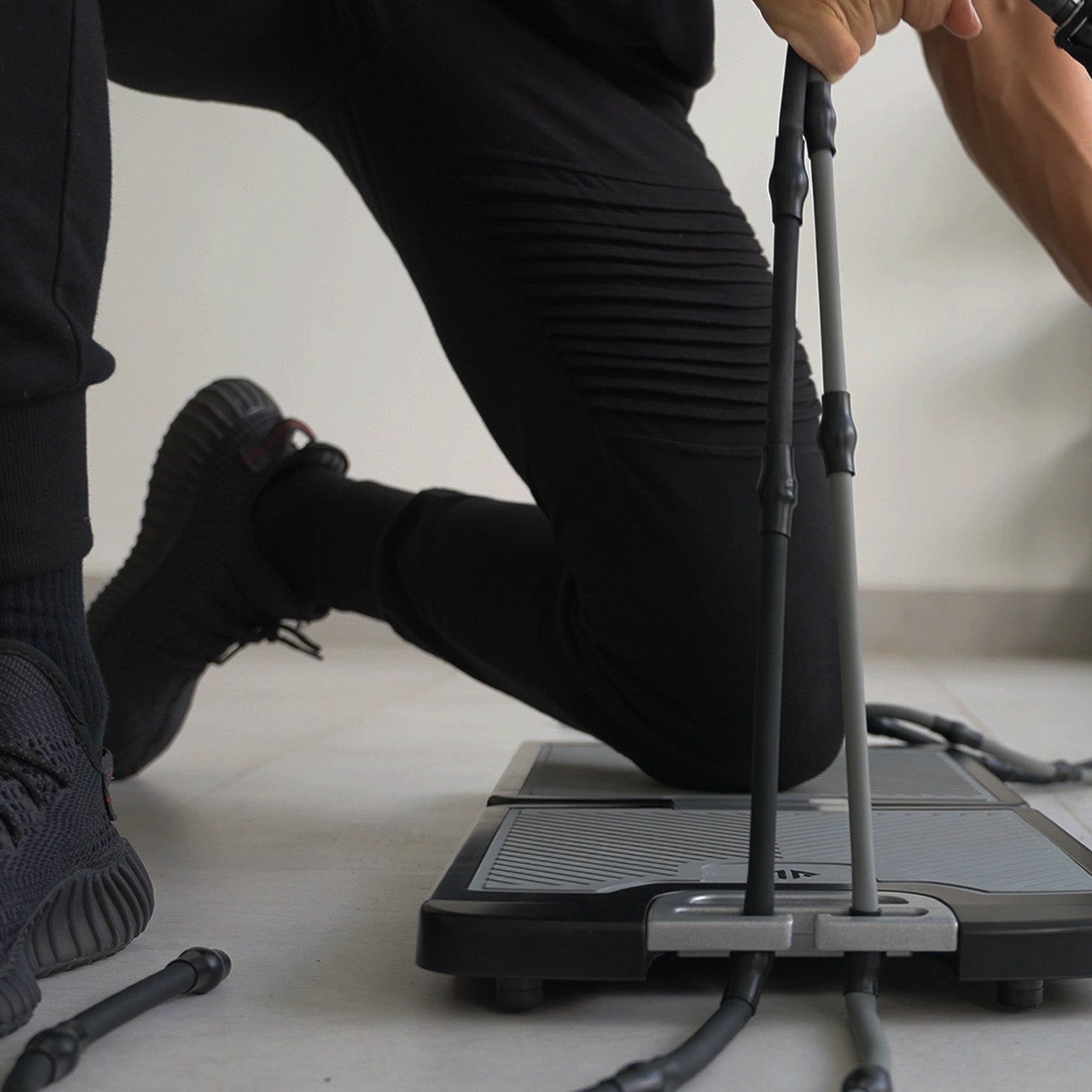 Selecting the band notch setting on the EVO Gym base